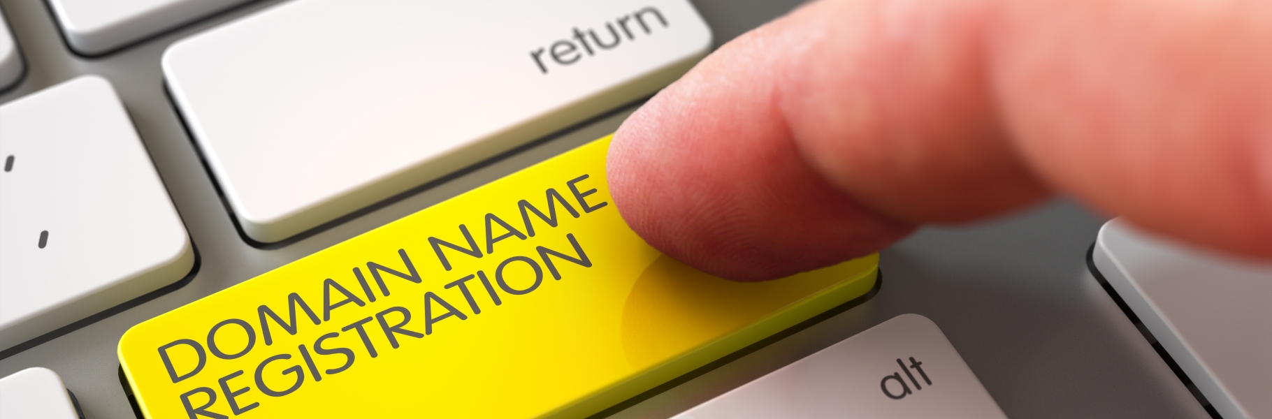 Close Up view of Male Hand Touching Yellow Domain Name Registration Computer Keypad. 3D.
